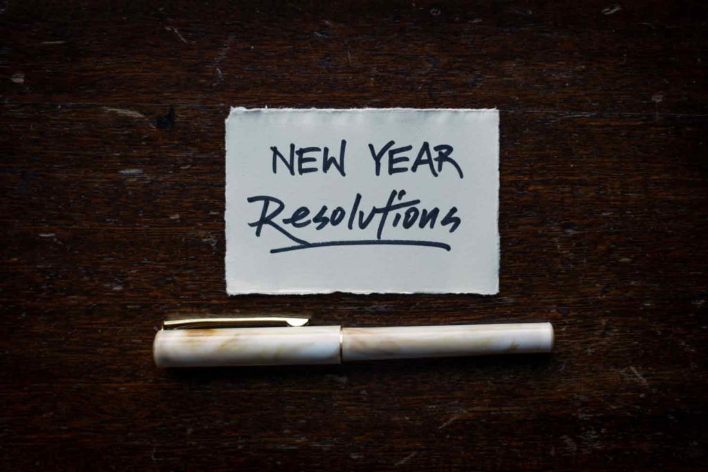 New Year Resolutions Zettel mit Stift